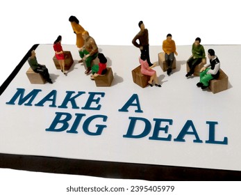 several people sat in groups. around them are the words "make a big deal" - Shutterstock ID 2395405979