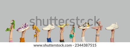 Several people's hands showcasing different colors and styles of summer shoes on isolated light grey background with copy space. Outlet marketing poster. Seasonal footwear promotion