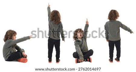 Several poses of the same child sitting on the floor and standing pointing with his finger