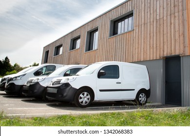 Several Row Of White Service Cars Vans And Trucks Parked In Parking Lot For Sale