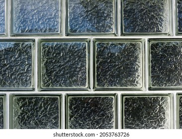 Several Rows Of Glass Blocks Used For A Window Showing Gaskets And Opaqueness In The Early Morning Light.