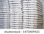 Several rows of pizza boxes, white pizza packing containers