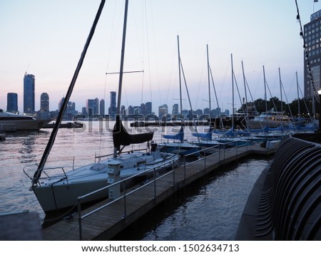 Several sailboats docked in Manhattan.