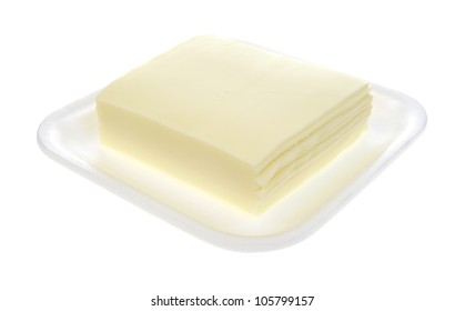 Several Slices Of White American Cheese On A Foam Tray.