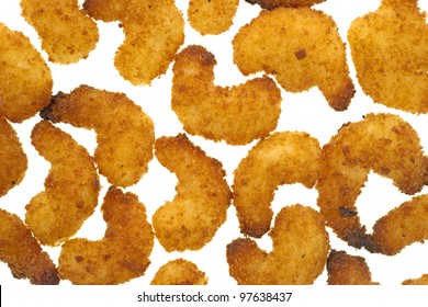 Several Small Pieces Of Popcorn Shrimp That Have Been Cooked On A White Background.