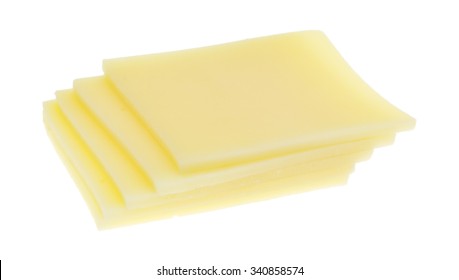 Several Square Slices Of Provolone Cheese Isolated On A White Background.