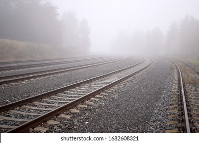 
Several train rails ending in fog - Powered by Shutterstock