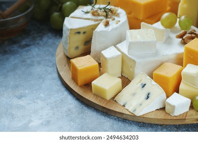 Several types of cheese served with honey and grapes - Powered by Shutterstock