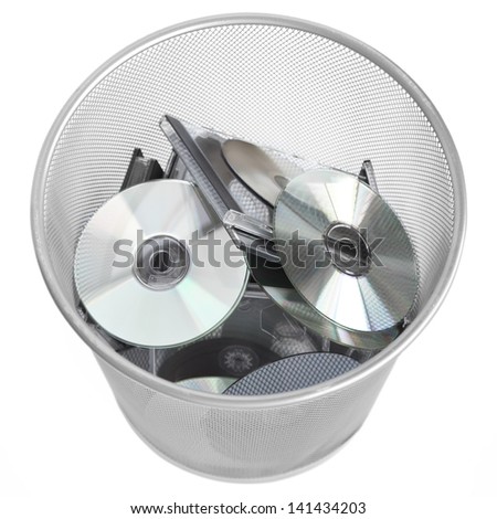 Several useless digital discs in the dustbin (with work path). Conceptual photo for technology development.