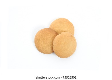 Several Vanilla Wafer Cookies On A White Background