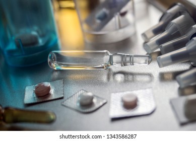 Several vials with different medication in hospital, conceptual image - Shutterstock ID 1343586287