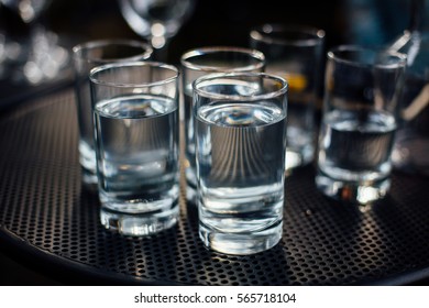 Several Water Glasses On Metal Table