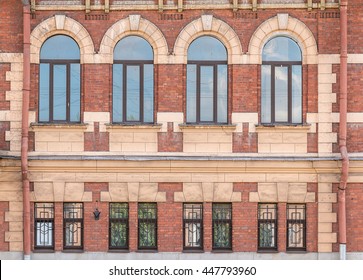 Several Windows In A Row On Facade Of Urban Apartment Building Front View, St. Petersburg, Russia
