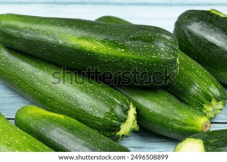 several zucchini isolated on a wooden table