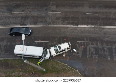 Severe accident. Car accidents. View from above. Accident, head-on collision of two cars. Violation of traffic rules, insured event. Drone photography.