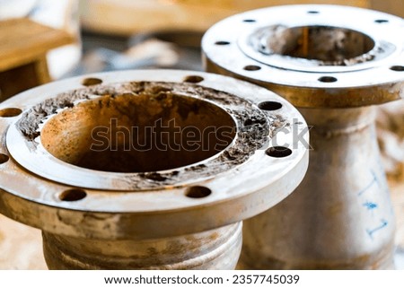 Severe corrosion of pipe flanges in the petroleum industry.
