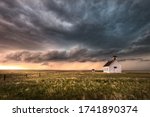 A severe thunderstorm approaches an old abandoned church in the countryside during the late afternoon in Colorado. 