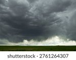 Severe Thunderstorm Clouds Over Eastern Colorado Plains Dramatic Sky. Dark thunderstorm clouds forming over the eastern plains of Colorado with rain shafts visible in the distance. Dramatic weather scene representing severe storms, climate, and atmospheric conditions.