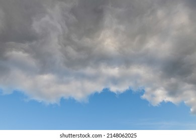 Severe Weather Cloud Front Advancing On A Blue Sky