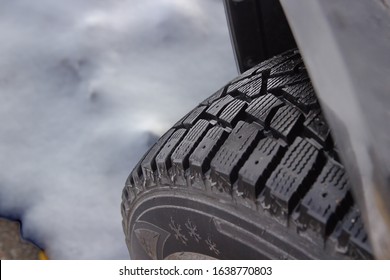 A severe weather rated front driver side, snow and ice tire, with stud holes. This is also an off road tire. 