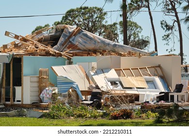 Severely Damaged By Hurricane Ian House In Florida Mobile Home Residential Area. Consequences Of Natural Disaster