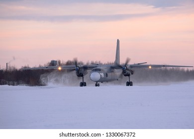 Severomorsk, Murmansk Region, Russia - February 28, 2012: Routine busy day at the airbase. Flying of An-26(is a twin-engined turboprop civilian and military transport aircraft)