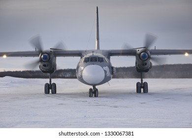 Severomorsk, Murmansk Region, Russia - February 28, 2012: Routine busy day at the airbase. Flying of An-26(is a twin-engined turboprop civilian and military transport aircraft)