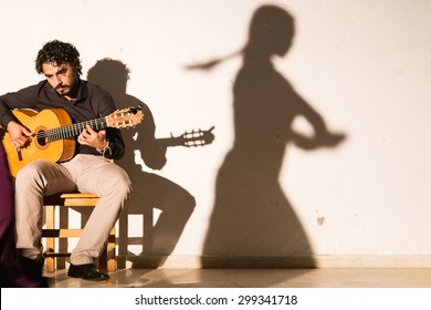 SEVILLA, SPAIN - JANUARY 4, 2015: Men Plays A Guitar An Sing Flamenco Music In Sevilla, Spain On January 4, 2015