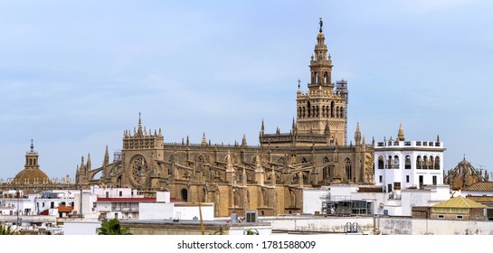 Seville Cathedral - A panoramic rooftop view of the roof of Seville Cathedral, with La Giralda tower rising high at behind, on a sunny Autumn day. Seville, Andalusia, Spain. - Shutterstock ID 1781588009