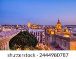 Seville City Skyline view with Illuminated Space Metropol Parasol in the Foreground at Dusk, Seville, Spain