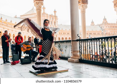 SEVILLE SPAIN, 1st MAY, 2018: Woman Dancing With The Traditional Flamenco Dress