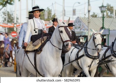 SEVILLE, SPAIN - APR, 25: woman riding horses and celebrating Seville's April Fair on April, 25, 2014 in Seville, Spain