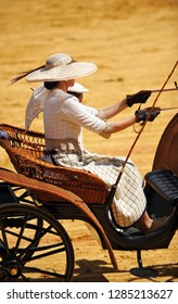 Seville, Spain - April 22, 2012: Spanish Woman With Pamela Driving A Horse Carriage At The Feria De Abril In Seville, Spain