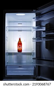 Seville, Spain; August 22 2022: A Bottle Of The Spanish Beer Label Cruzcampo On An Empty Fridge