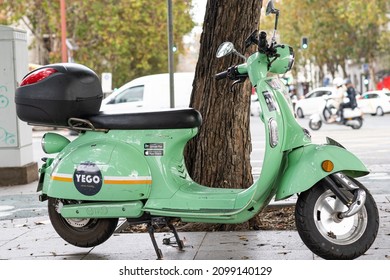 Seville, Spain- December 27th, 2021: A Yego Electric Rideshare Scooter Parked On A Sidewalk In Seville, Spain.