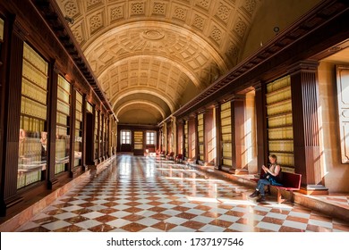 SEVILLE, SPAIN: Lonely Visitor Of The 16th Century Archivo General De Indias, Example Of Spanish Renaissance Architecture On November 14, 2018. UNESCO World Heritage Site