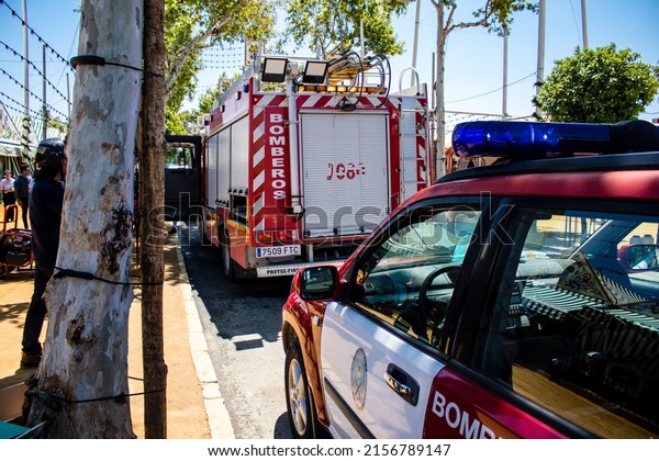 Seville, Spain - May 05, 2022 Firefighter in\
intervention at Feria de Sevilla, the most famous festival in\
Spain, This celebration is back after two years of absence due to\
an epidemic of covid