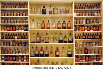 Seville, Spain - May16, 2012: Antique Apothecary Jars Of Glass With Medicinal Compounds On The Old Pharmacy Shelve