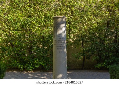 Seville, Spain, September 12, 2021: The Royal Palace Of Seville (Real Alcazar). A Column Dedicated To The Memory Of Poet King Al-Mutamid At The Garden Of The Galley.