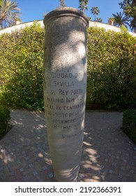 Seville, Spain, September 12, 2021: The Royal Palace Of Seville (Real Alcazar). A Column Dedicated To The Memory Of Poet King Al-Mutamid At The Garden Of The Galley.