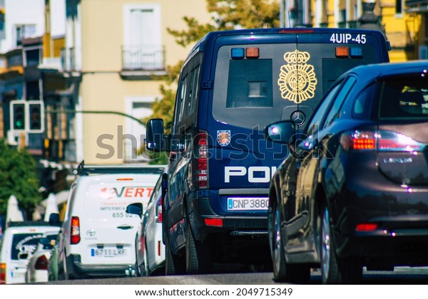 Seville Spain\
September 22, 2021 Police car patrolling in the streets of Seville\
during the coronavirus outbreak hitting Spain, wearing a mask in\
the street is not\
mandatory