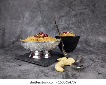 Seviyan Or Vermicelli Kheer, An Indian Dessert Made Of Semolina Noodles Topped With Rose Petals And Dry Fruits Such As Cashews.