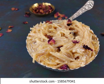 Seviyan Or Vermicelli Kheer, An Indian Dessert Made Of Semolina Noodles Topped With Rose Petals And Dry Fruits Such As Cashews.