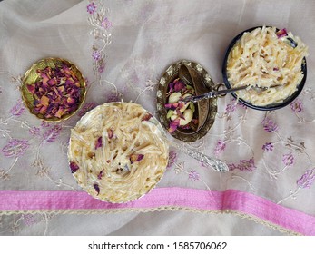 Seviyan Or Vermicelli Kheer, An Indian Dessert Made Of Semolina Noodles Topped With Rose Petals And Dry Fruits Such As Cashews.