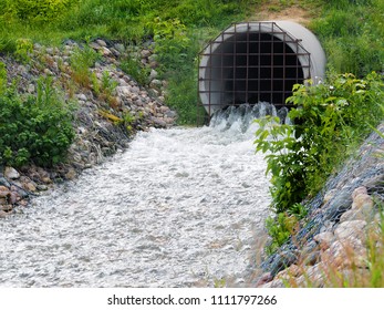 Sewage Treatment Plant Pipe Outlet On The Outskirts Of The City In Spring