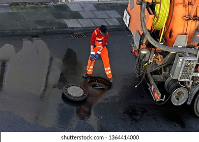 Sewer Cleaning.
Sewage Worker On Cleans Pipe
