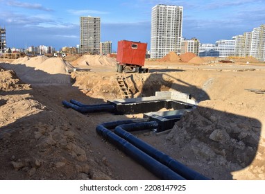 Sewer Construction. Laying Of Storm Sewer Pipes At The Construction Site. Installation Of Water Main And Sanitary Sewer. Ground Water Drainage System Pipes. 