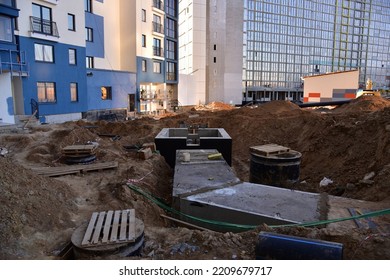 Sewer Construction. Laying Of Storm Sewer Pipes At The Construction Site. Installation Of Water Main And Sanitary Sewer. Ground Water Drainage System Pipes. 