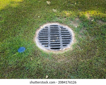 Sewer Drain Cover In Grass Geound