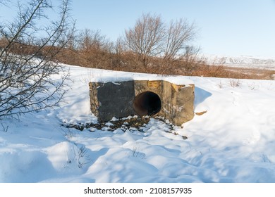 Sewer Drain Covered With Snow